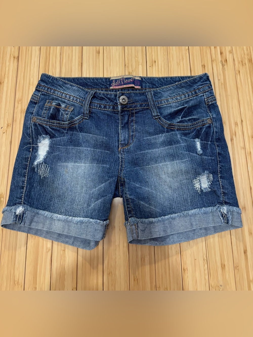 Wallflower size 7 distressed denim shorts. Slight spot on front. See pic.